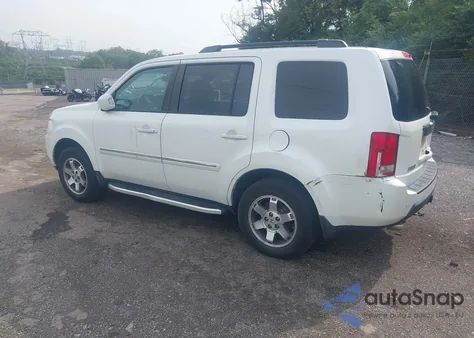 2011 Honda Pilot Touring z USA, uszkodzony, nr VIN 5FNYF4H92BB017270